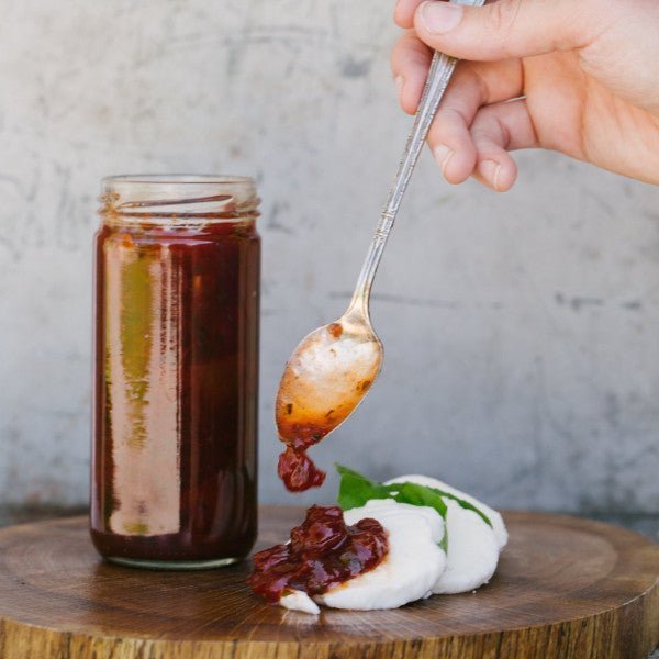 Oven Roasted Tomato Jam with Garlic & Herbs - Copper Pot & Wooden Spoon